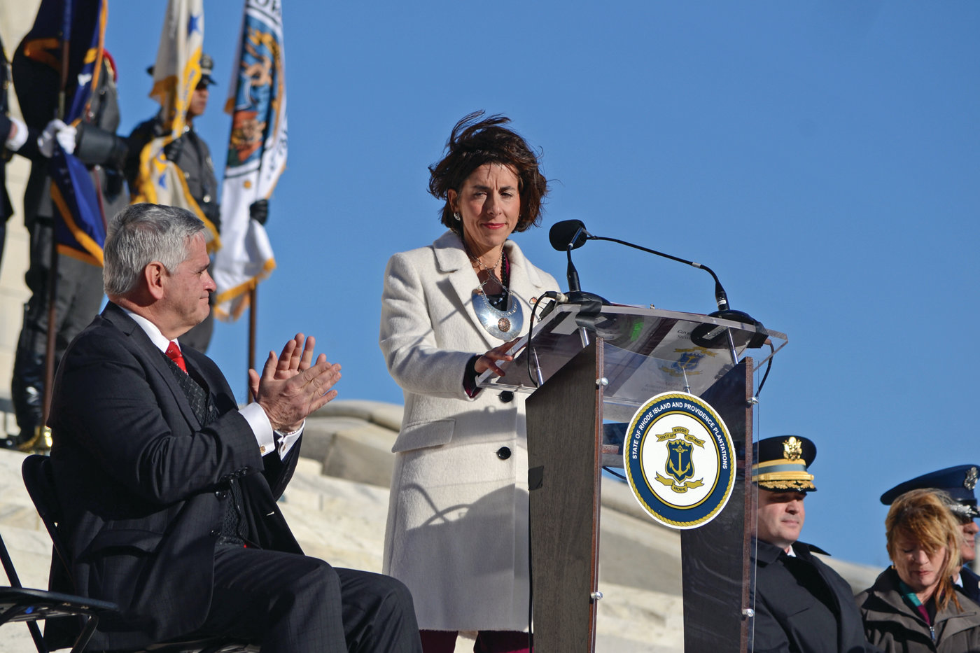 HOPE FOR THE FUTURE: Governor Gina Raimondo addresses the crowd as the strong winds gusted through Providence on Tuesday afternoon.